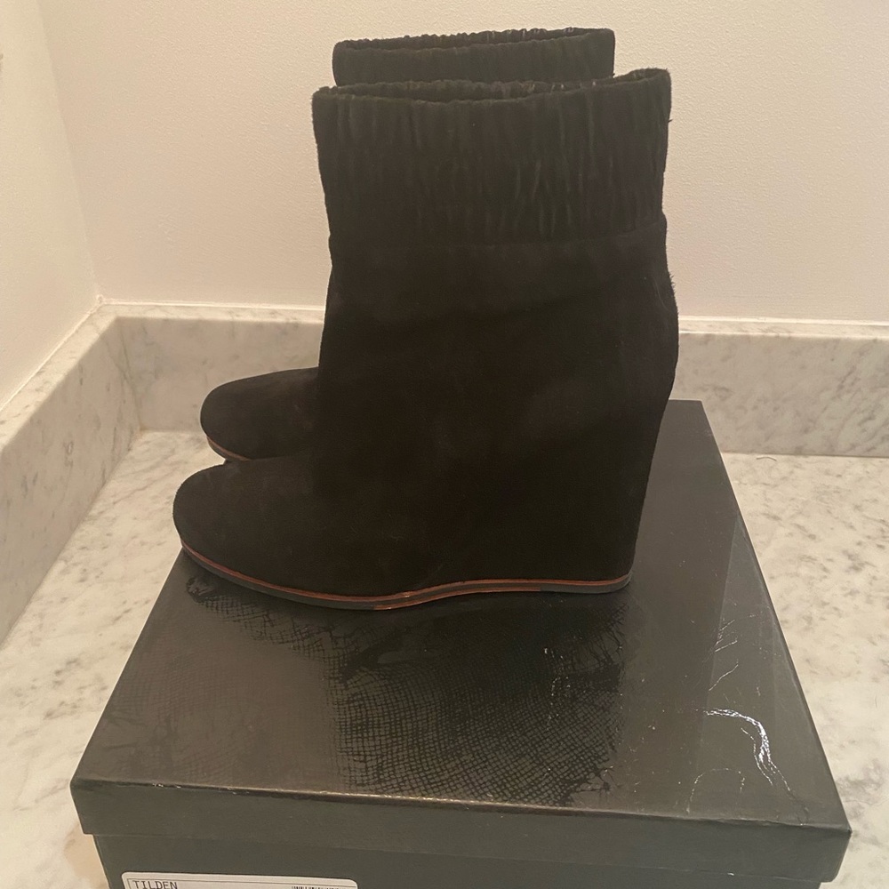 Black suede wedge Dolce Vita slide on boots. Gently worn. Good condition.